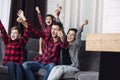 Happy beautiful fashion family fun together at home in living room smiling sitting on sofa portrait Royalty Free Stock Photo