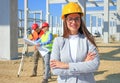 Happy beautiful female architect on construction site Royalty Free Stock Photo