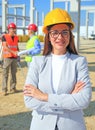 Happy beautiful female architect on a construction site Royalty Free Stock Photo