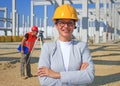 Happy beautiful female architect on a construction site Royalty Free Stock Photo