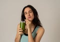 Happy beautiful fit sport woman smiling and drinking healthy fresh vegetable detox smoothie Royalty Free Stock Photo