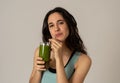 Happy beautiful fit sport woman smiling and drinking healthy fresh vegetable detox smoothie Royalty Free Stock Photo