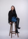 Happy beautiful girl model in black dress posing in studio isolated on white background,Teen girl in in blue jeans and black boots