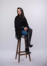 Happy beautiful girl model in black dress posing in studio isolated on white background,Teen girl in in blue jeans and black boots