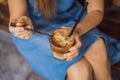 Happy beautiful girl sitting on stairs in park and drinking ice coffee Royalty Free Stock Photo