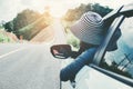 Happy beautiful girl traveling in a hatchback car Royalty Free Stock Photo