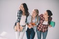 Happy beautiful girls students holding books and looking away Royalty Free Stock Photo