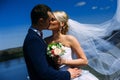 happy and beautiful groom and bride tender kiss at spring outdoo Royalty Free Stock Photo