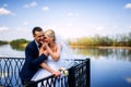 happy and beautiful groom and bride tender kiss at spring outdoo Royalty Free Stock Photo