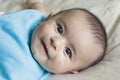 Happy beautiful hispanic baby boy cooing. Royalty Free Stock Photo