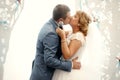 Happy beautiful kissing newlyweds