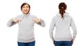Happy beautiful middle-aged woman pointed on gray hoodie mock up, hood mockup set Royalty Free Stock Photo