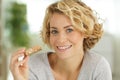 happy beautiful pregnant woman eating cereal bar Royalty Free Stock Photo