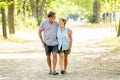 Happy senior couple walking and enjoying life outdoors Royalty Free Stock Photo