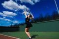 Happy beautiful sexy girl playing tennis on the court. Sport and recreation, leisure Royalty Free Stock Photo