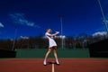 Happy beautiful sexy girl playing tennis on the court. Sport and recreation, leisure Royalty Free Stock Photo