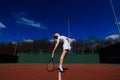 Happy beautiful sexy girl playing tennis on the court. Sport and recreation, leisure Royalty Free Stock Photo