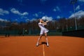 Happy beautiful sexy girl playing tennis on the court. Sport and recreation, leisure Royalty Free Stock Photo