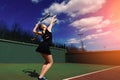 Happy beautiful sexy girl playing tennis on the court. Sport and recreation, leisure Royalty Free Stock Photo