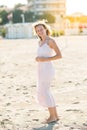 Happy beautiful smiling young woman enjoy sun and wind at the sand beach Royalty Free Stock Photo