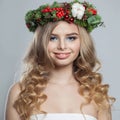 Happy beautiful stylish lady with makeup, long shiny wavy hairdo on white background. Christmas woman portrait Royalty Free Stock Photo