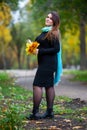 Happy beautiful woman in autumn, cute plus size model outdoors, full length portrait