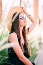 Happy beautiful woman in black summer dress walking and cheerful smiling in the city Royalty Free Stock Photo