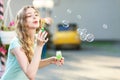 Happy woman blowing soap bubbles Royalty Free Stock Photo