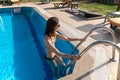 Happy beautiful woman coming out from swimming pool Royalty Free Stock Photo