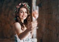 Happy beautiful woman holding wineglass cheers to you