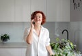 Happy beautiful woman involved in pleasant smartphone call conversation with friends sharing discussing life news, smiling female Royalty Free Stock Photo