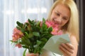 Happy beautiful woman reads a love letter. girl reads note from her beloved boyfriend. Royalty Free Stock Photo