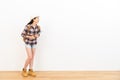 Happy beautiful woman standing on wooden floor Royalty Free Stock Photo