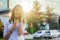 Happy beautiful woman walking and writing or reading sms message Royalty Free Stock Photo