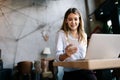 Happy young beautiful woman working, surfing, studying on laptop Royalty Free Stock Photo