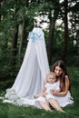 Happy beautiful woman, young mother playing with her adorable baby son, cute little boy, enjoying together a sunny warm Royalty Free Stock Photo