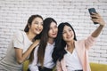 Happy beautiful young asian woman friendship selfie together , Happiness teenagers taking pictures selfie in living room