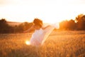 Happy beautiful young bride outside on a summer meadow at the sunset Royalty Free Stock Photo