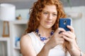 Happy beautiful young businesswoman using smart phone smiling Royalty Free Stock Photo