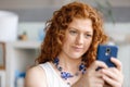 Happy beautiful young businesswoman using smart phone smiling Royalty Free Stock Photo