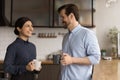 Happy female indian employee communicating with male colleague. Royalty Free Stock Photo