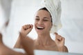 Happy beautiful young hispanic woman cleaning teeth with dental floss. Royalty Free Stock Photo