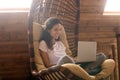 Happy beautiful young hispanic woman using computer at home. Royalty Free Stock Photo