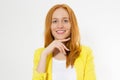 Happy beautiful young red head woman in a stylish yellow jacket copy space. Attractive red hair girl looking away Royalty Free Stock Photo