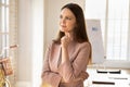 Happy beautiful young startup manager girl standing in office