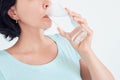 Happy beautiful young woman drinking water. Smiling caucasian female model holding transparent glass in her hand Royalty Free Stock Photo