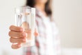 Happy beautiful young woman holding drinking water glass Royalty Free Stock Photo