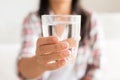 Happy beautiful young woman holding drinking water glass Royalty Free Stock Photo