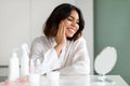 Happy beautiful young woman looking at mirror at home Royalty Free Stock Photo