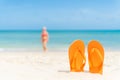 Happy beautiful young woman in pink bikini with flip flop Royalty Free Stock Photo